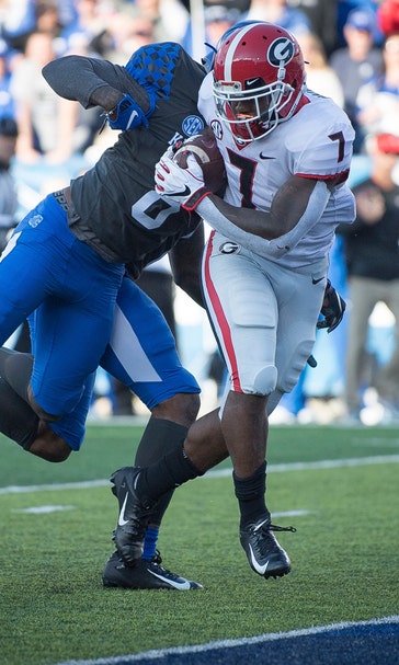 No. 6 Georgia tops No. 11 Kentucky 34-17 to clinch SEC East